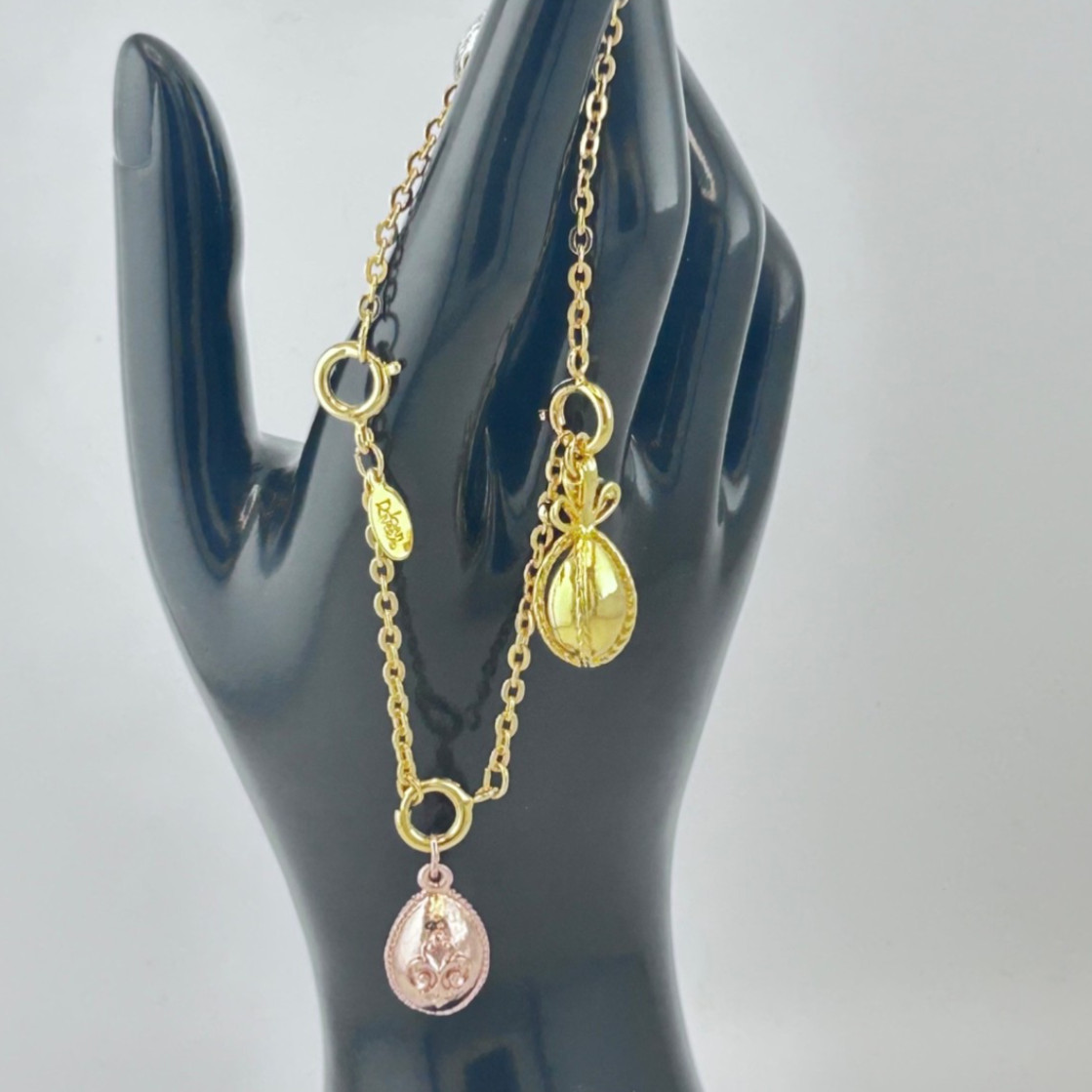Joan Rivers Vintage gold, silver, and rose tone Charms Bracelet