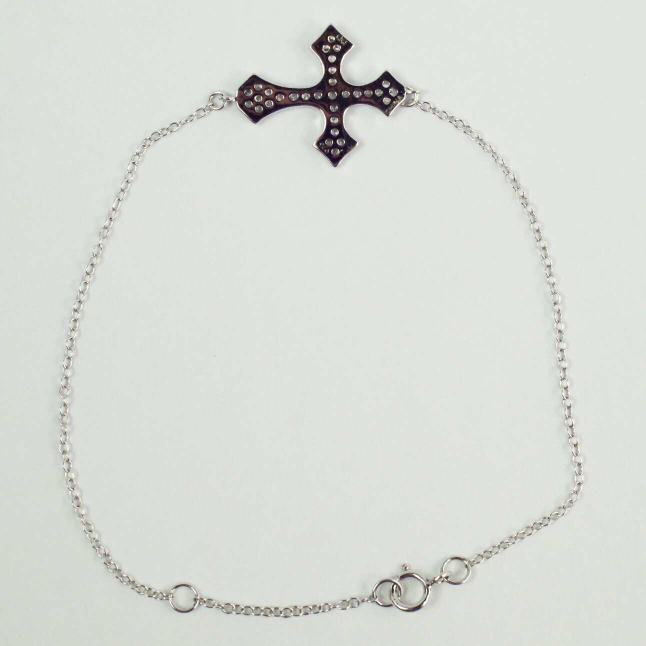 Sterling silver white/colorless CZ pavé cable chain cross bracelet