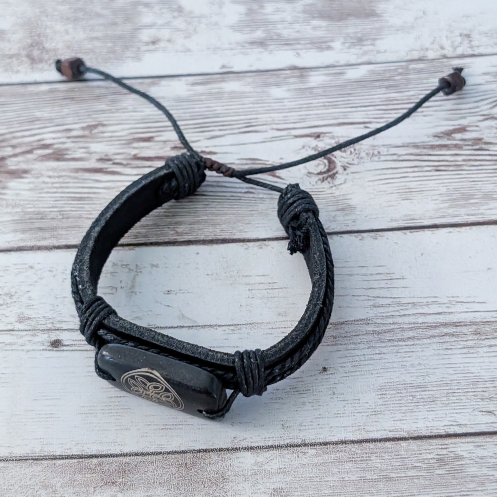 Tie Bracelet with Celtic Like Charm – Leather?