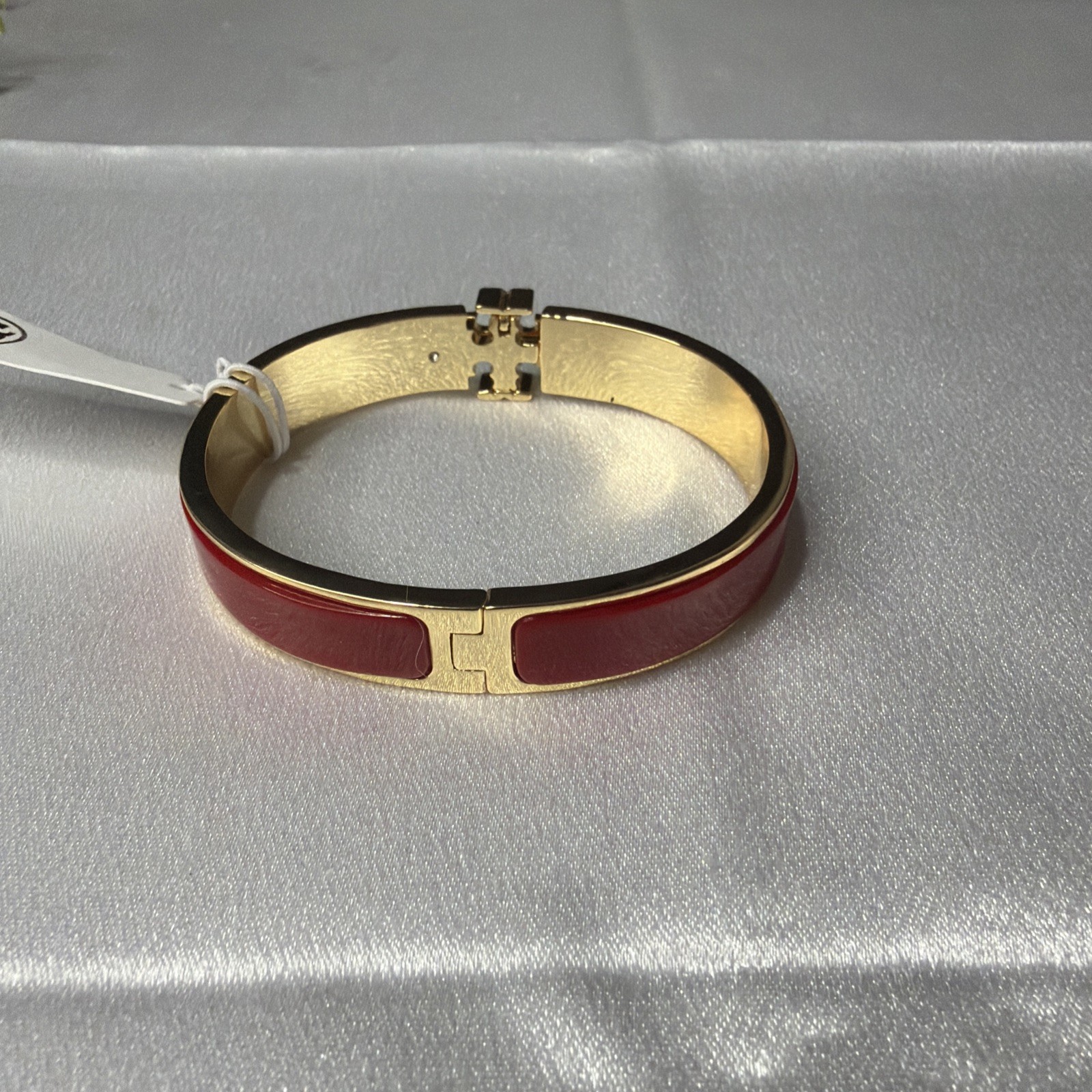 Brand new Tory Burch gold and red bracelet