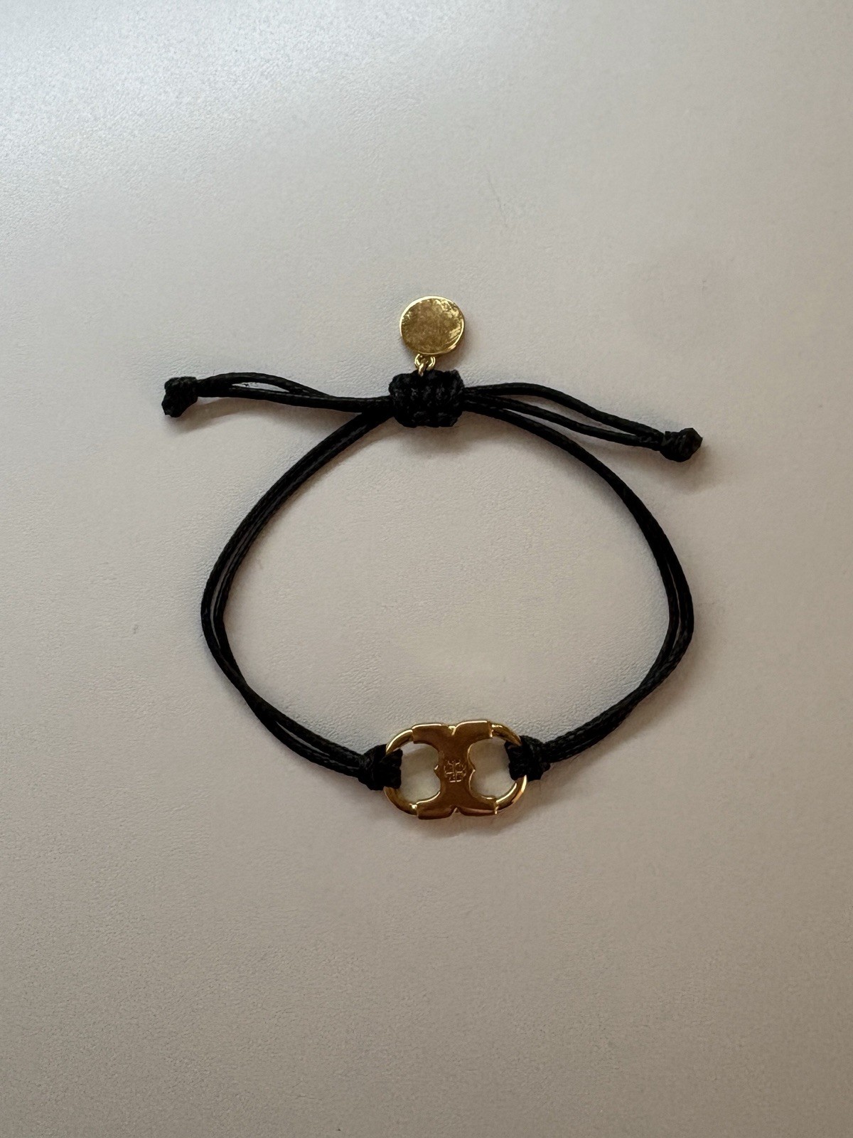 Tory Burch Black Cord Adjustable Slide Bracelet Gold Tone Dangle Charm Signed