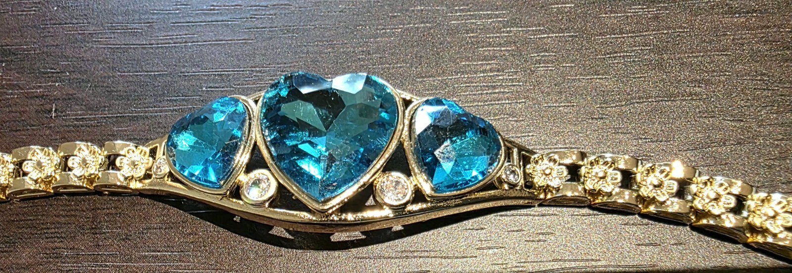 Gold Filled Bracelet With Delicate Design And Sparkly Blue Rhinestone. $28