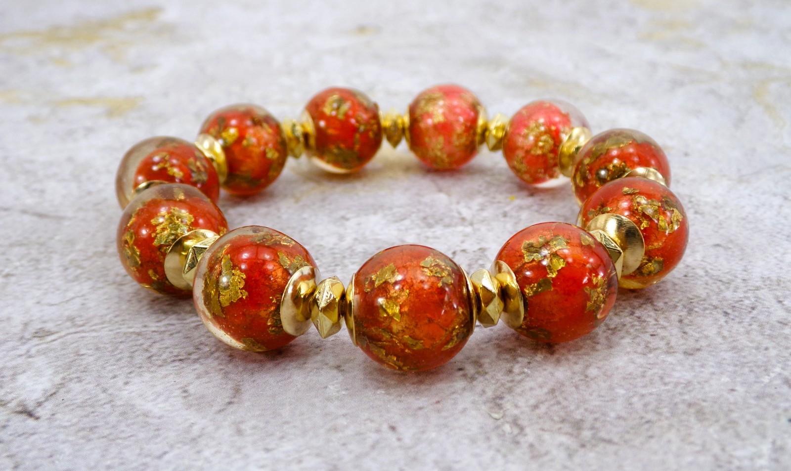 Red and gold bead stretch bracelet with gold leaf resin beads gold spacers New