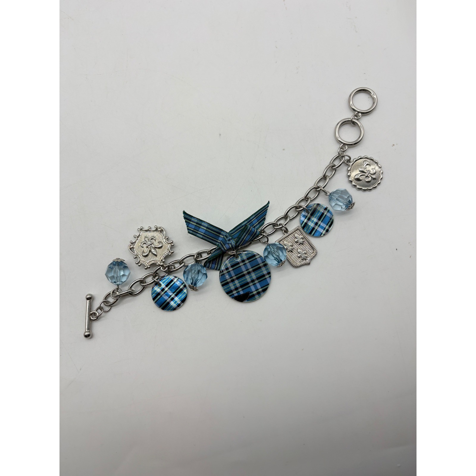 Blue Plaid Fleur De Lis Charm Bracelet Silver Tone Toggle Clasp Glass Bead Bow