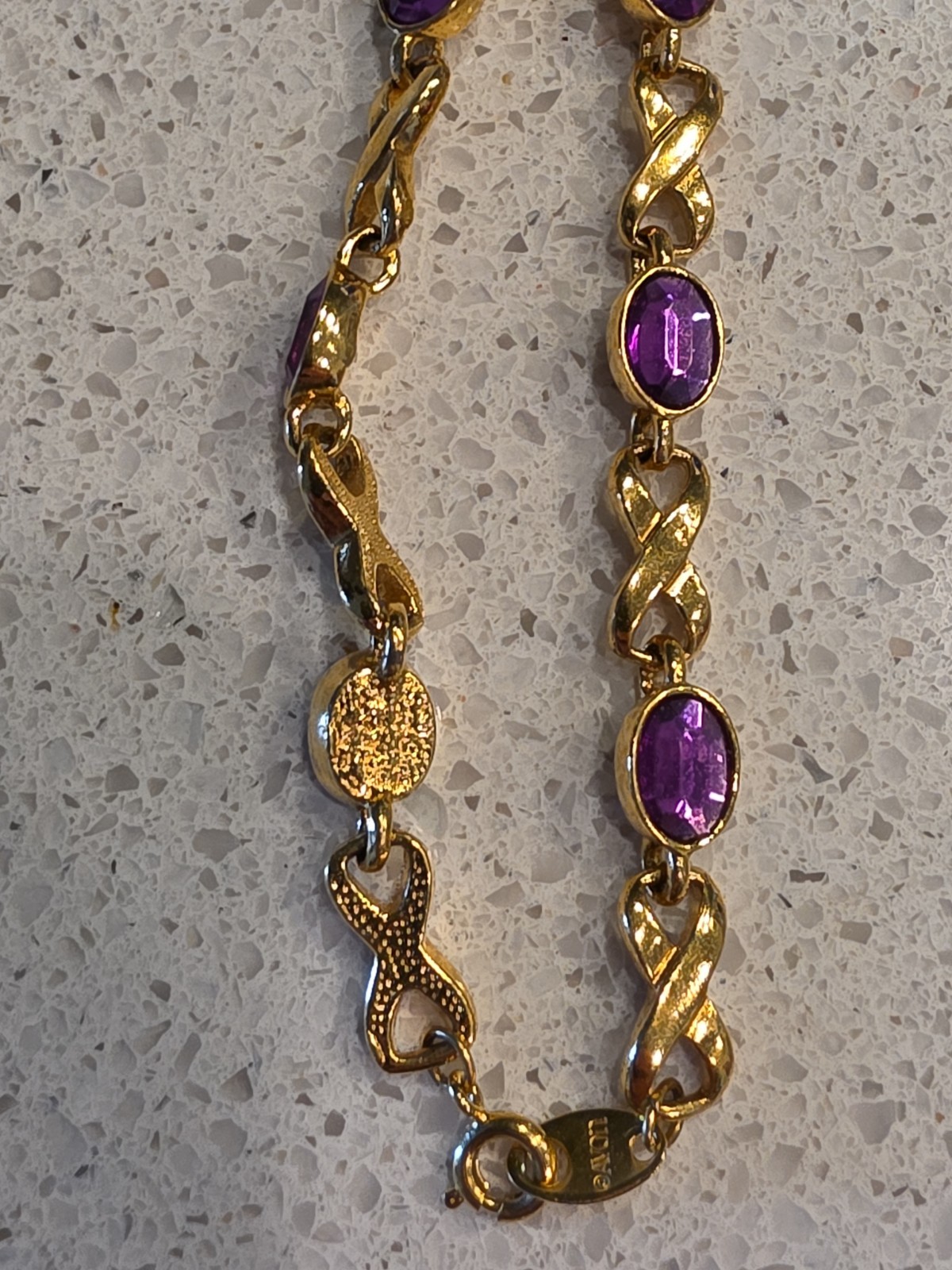 Vintage AVON Gold Tone & Amethyst Infinity Bracelet Spring Ring Fashion Costume