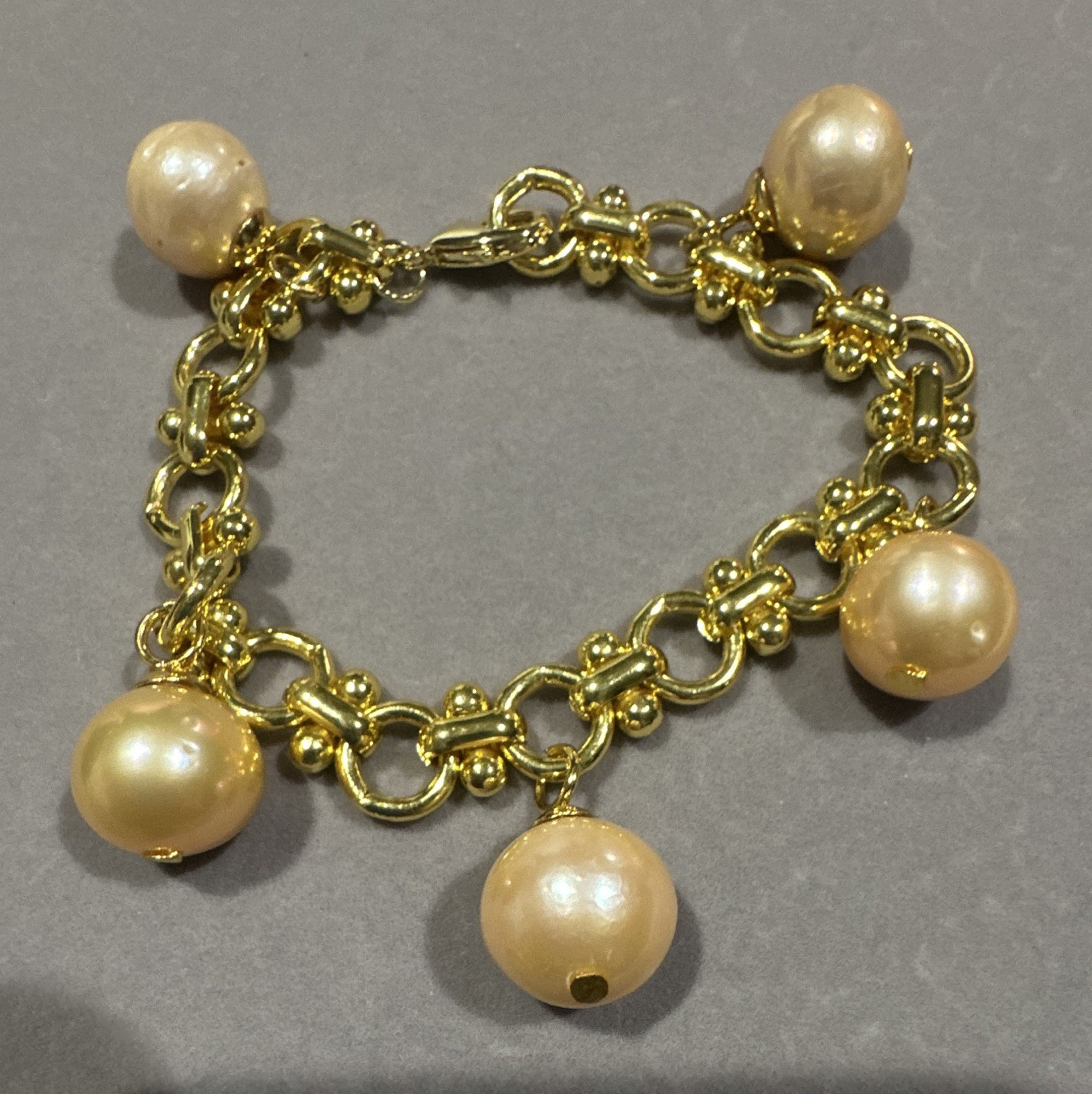 Genuine Pink Freshwater Pearls in Micron-setting. 10.5 – 11mm