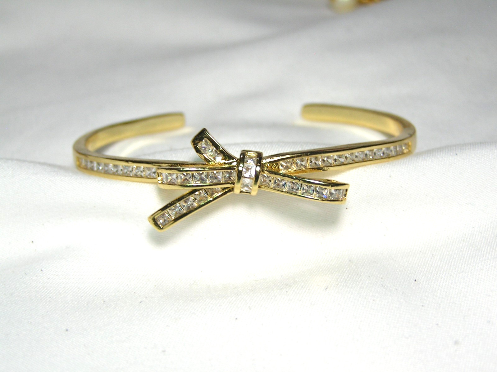 …Beautiful Gold Tone, Channel Set Square Crystals Bow Cuff Bracelet…