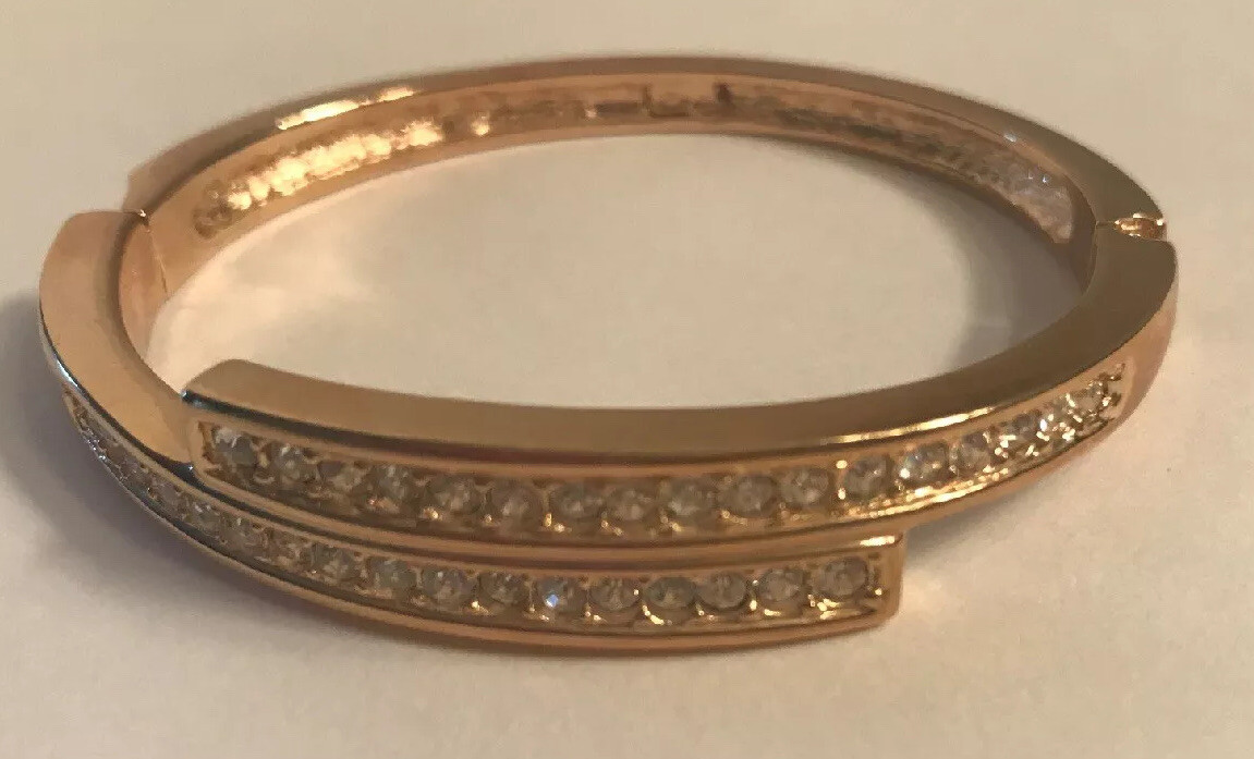Roman signed Gold toned Overlap Bracelet with CZ stones