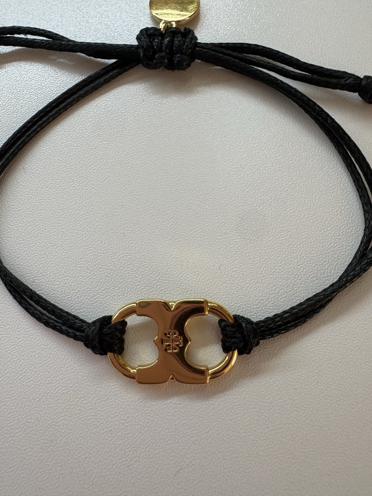 Tory Burch Black Cord Adjustable Slide Bracelet Gold Tone Dangle Charm Signed