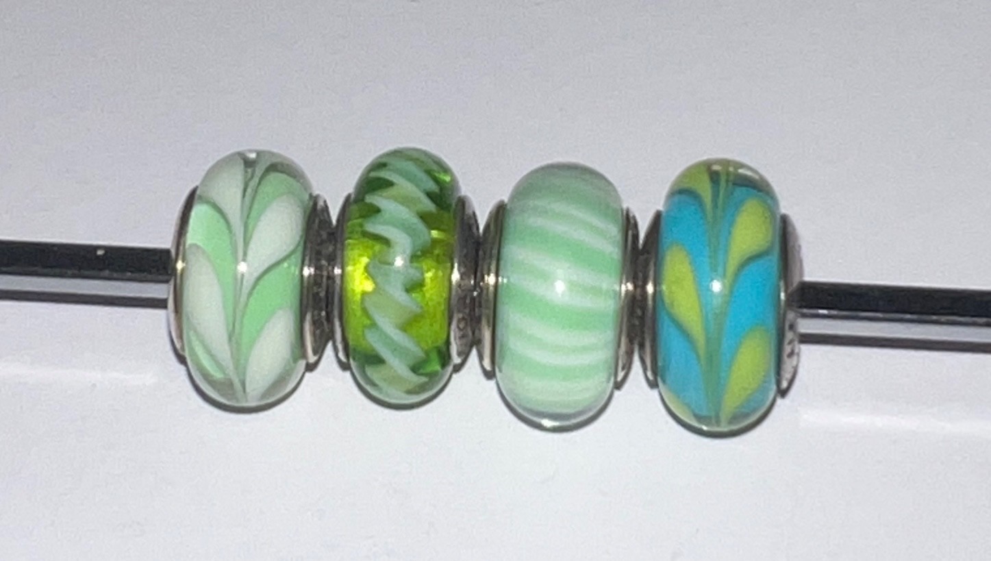 Set of 4 retired Pandora green Murano charms – complete descriptions listed