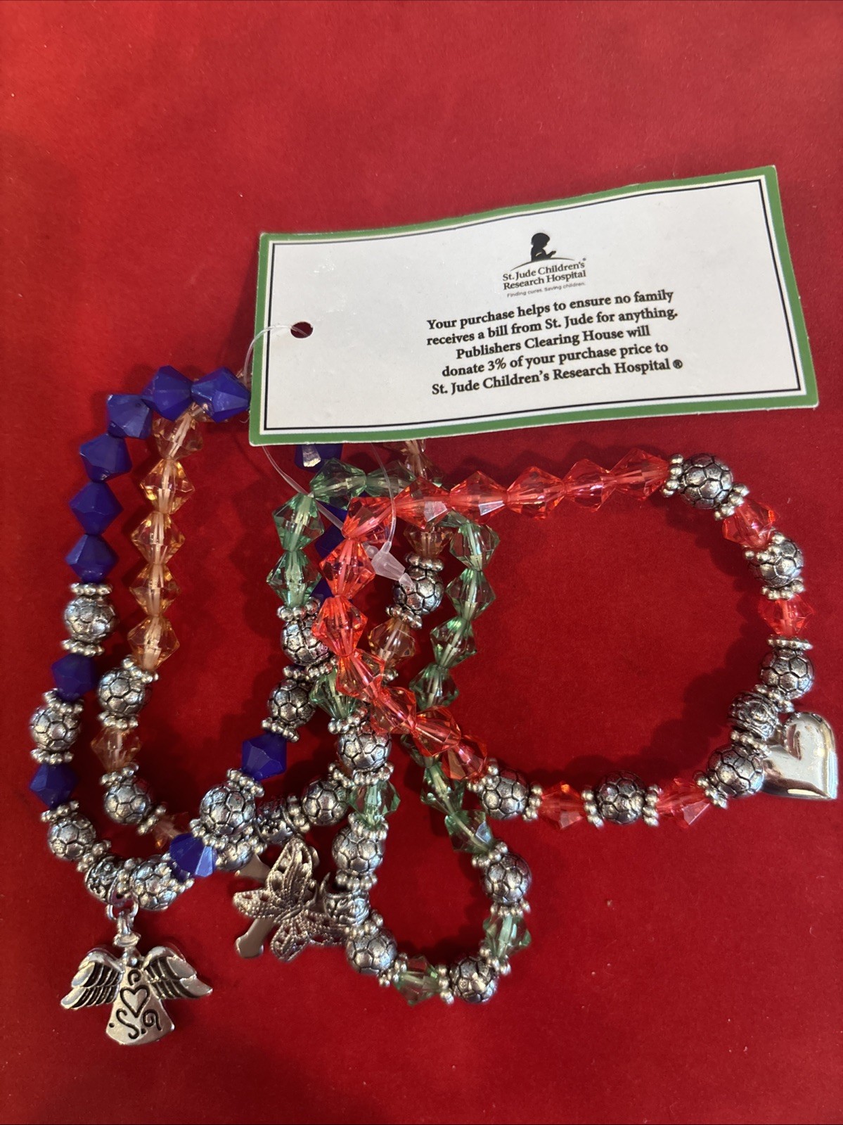Set Of 4 Stretch Charm Bracelets Red Blue Green Yellow NWOT