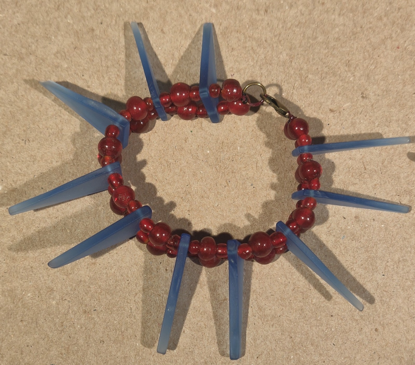 Bracelets set two for battle or love vintage red blood glass and blue blood glas
