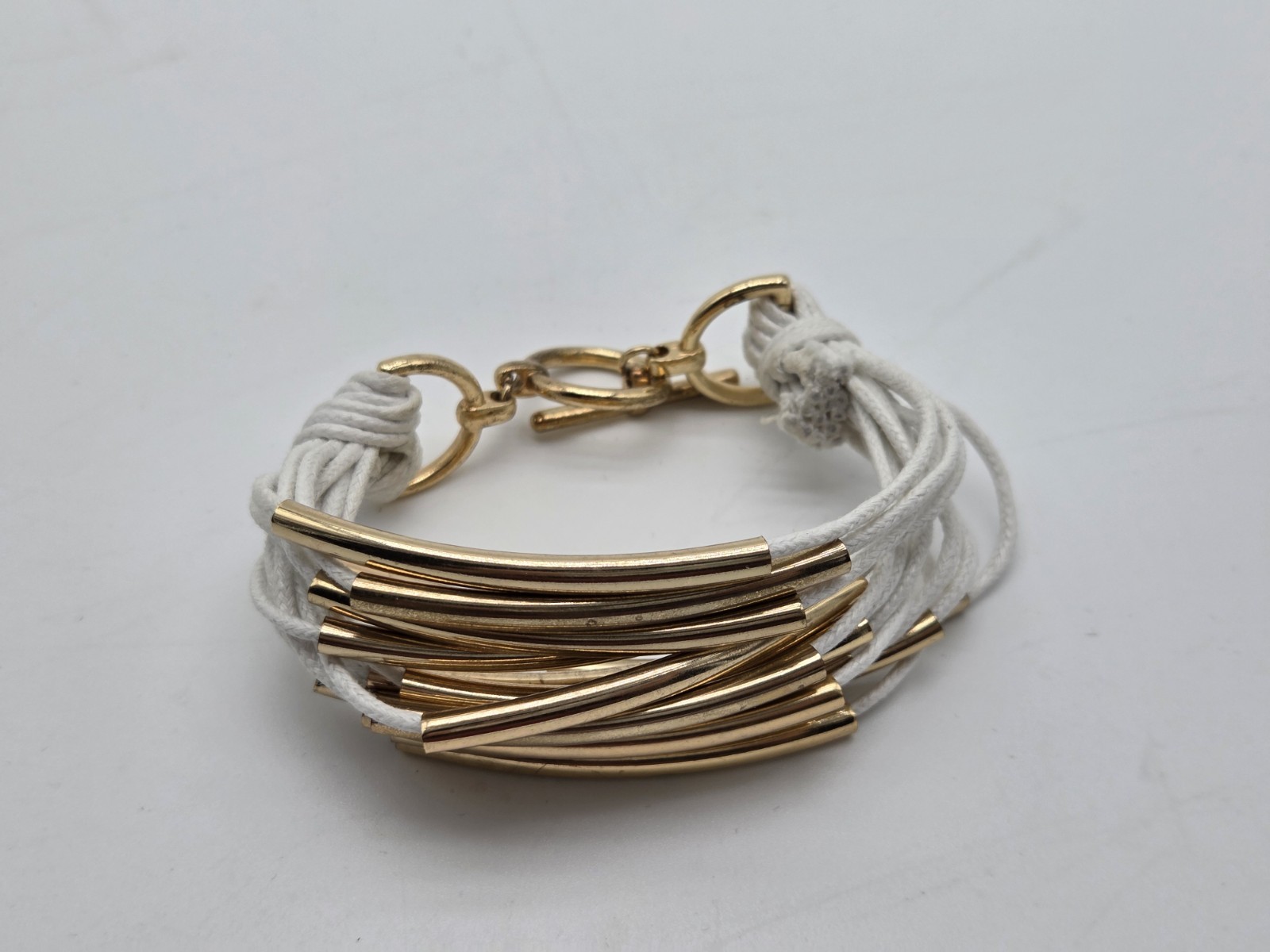 Gold Tone Multi Strand White Cord Tube Bracelet Toggle Clasp Boho Statement…