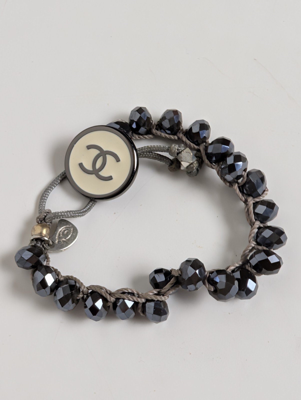Chanel Button Logo Beaded Cord Bracelet Hematite Tone Gray IJewels Charm