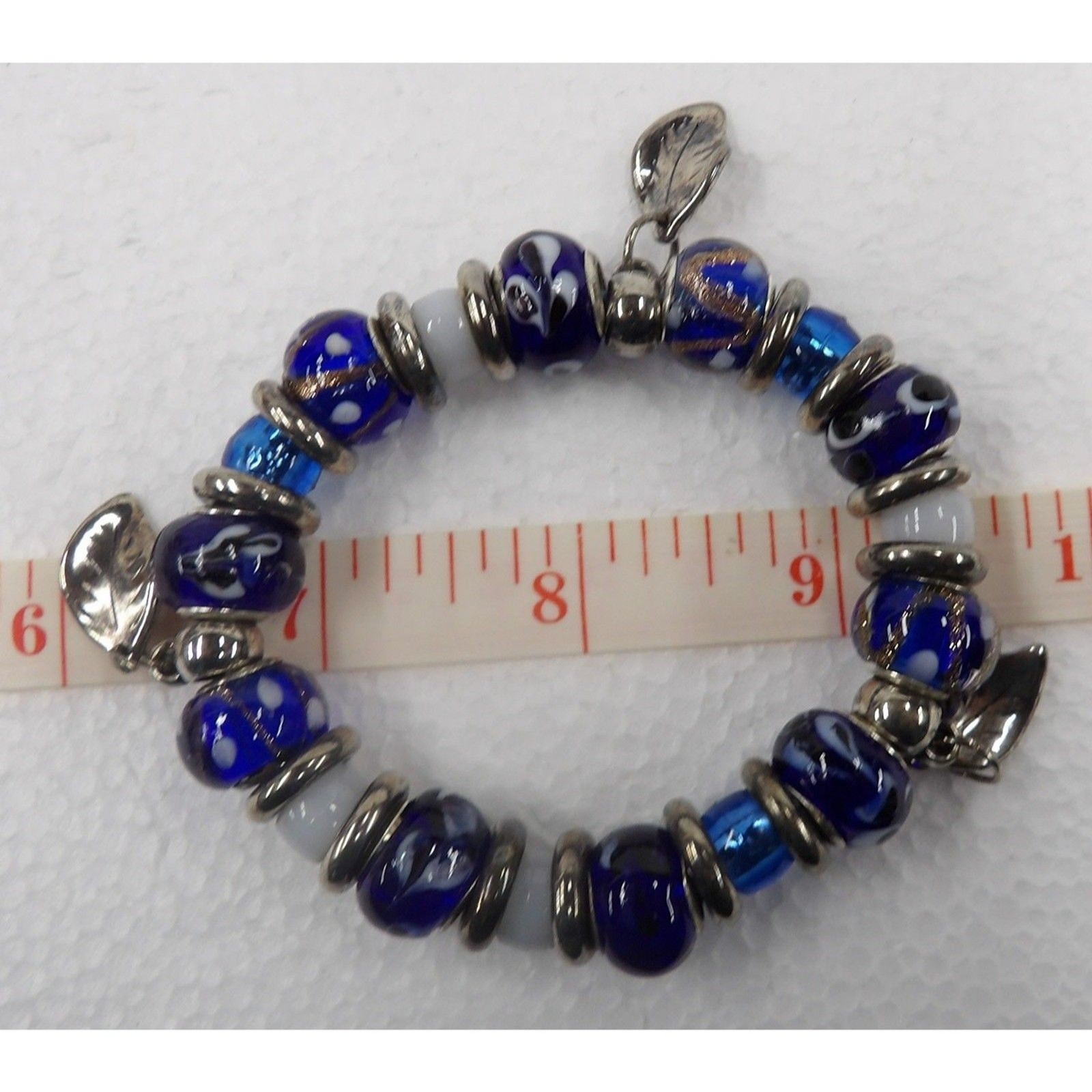 Stretch Bracelet with Blue/White Glass & Silver Tone Metal Beads & Charms
