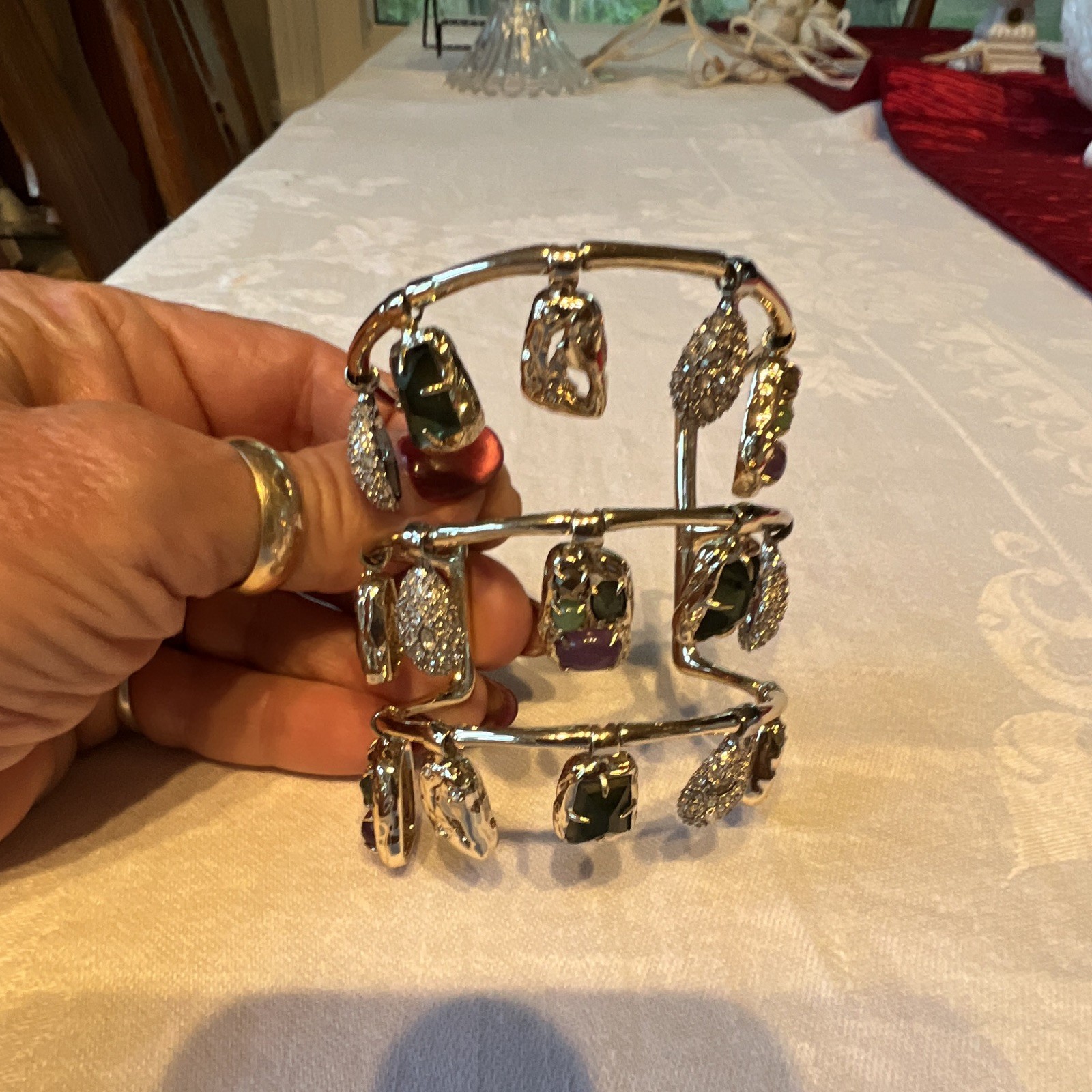 A stunning swinging gold-tone cuff designed by Alexis Bittar. The bracelet featu