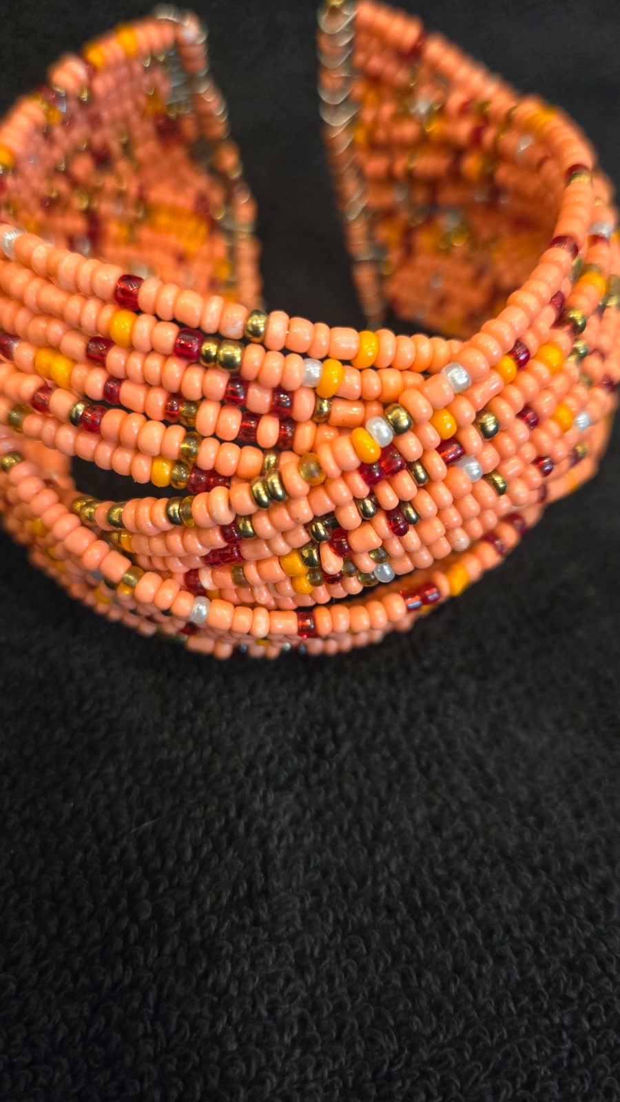 Salmon bead strecthable cuff, good condition