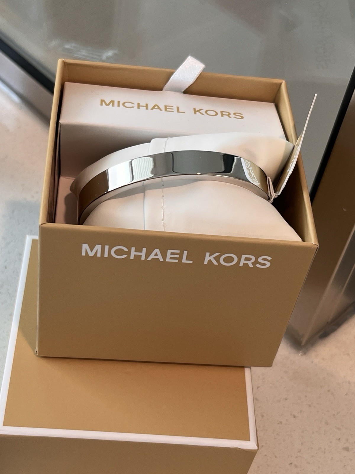Michael Kors Silver Tone Stainless Steel Pavé Crystal Logo Hinged Bangle