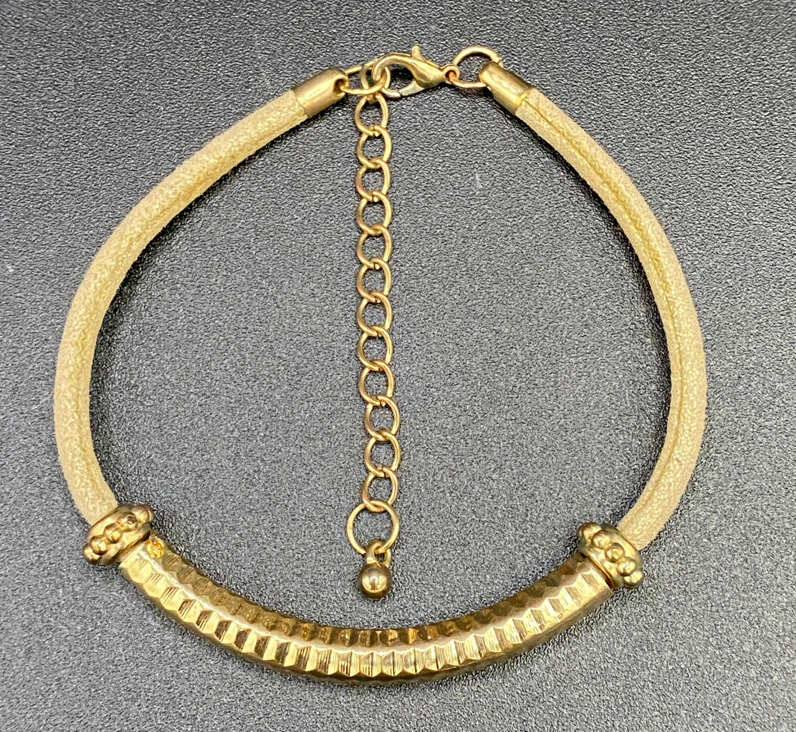 Gold Tone Metal and Champagne Cord Bracelet