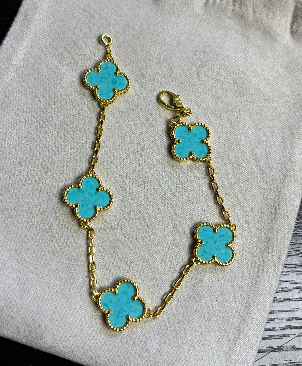 Gold Tone Blue Clover Station Dangle Charms Lobster Clasp. Used