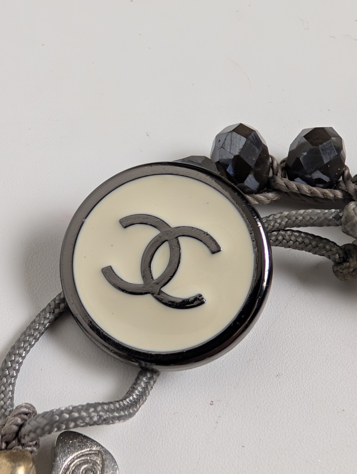 Chanel Button Logo Beaded Cord Bracelet Hematite Tone Gray IJewels Charm