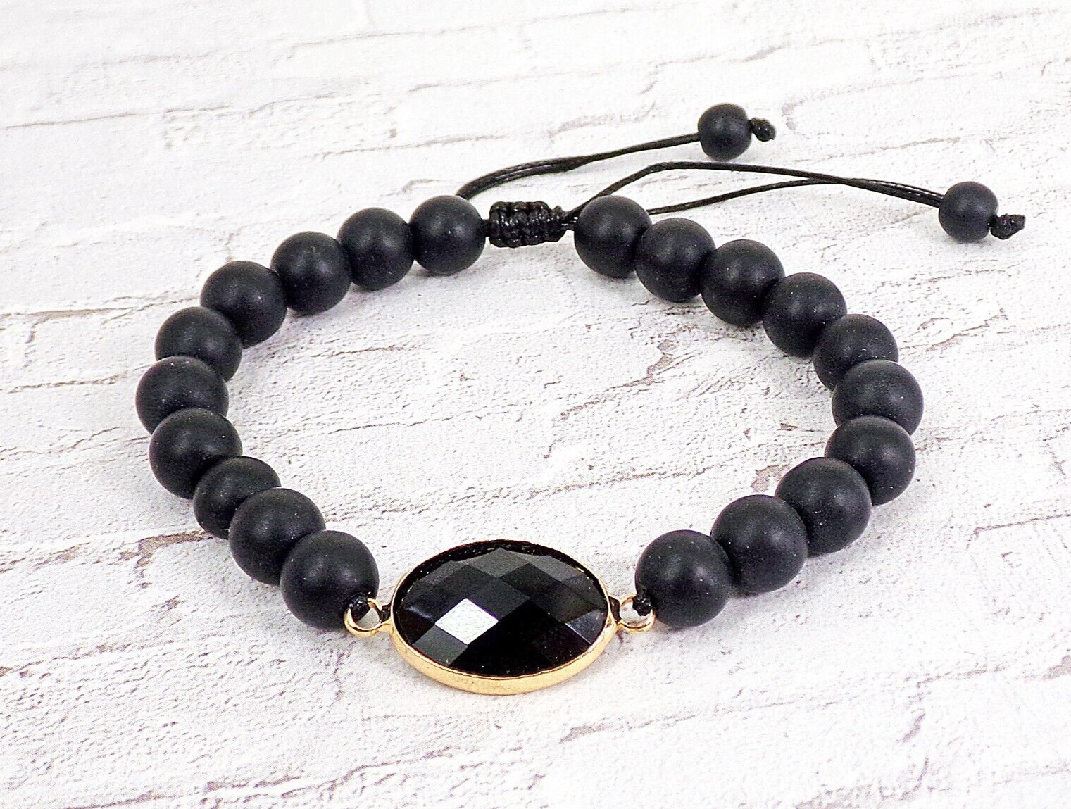 Black stone bead bracelet with black glass bead and adjustable size tie back New