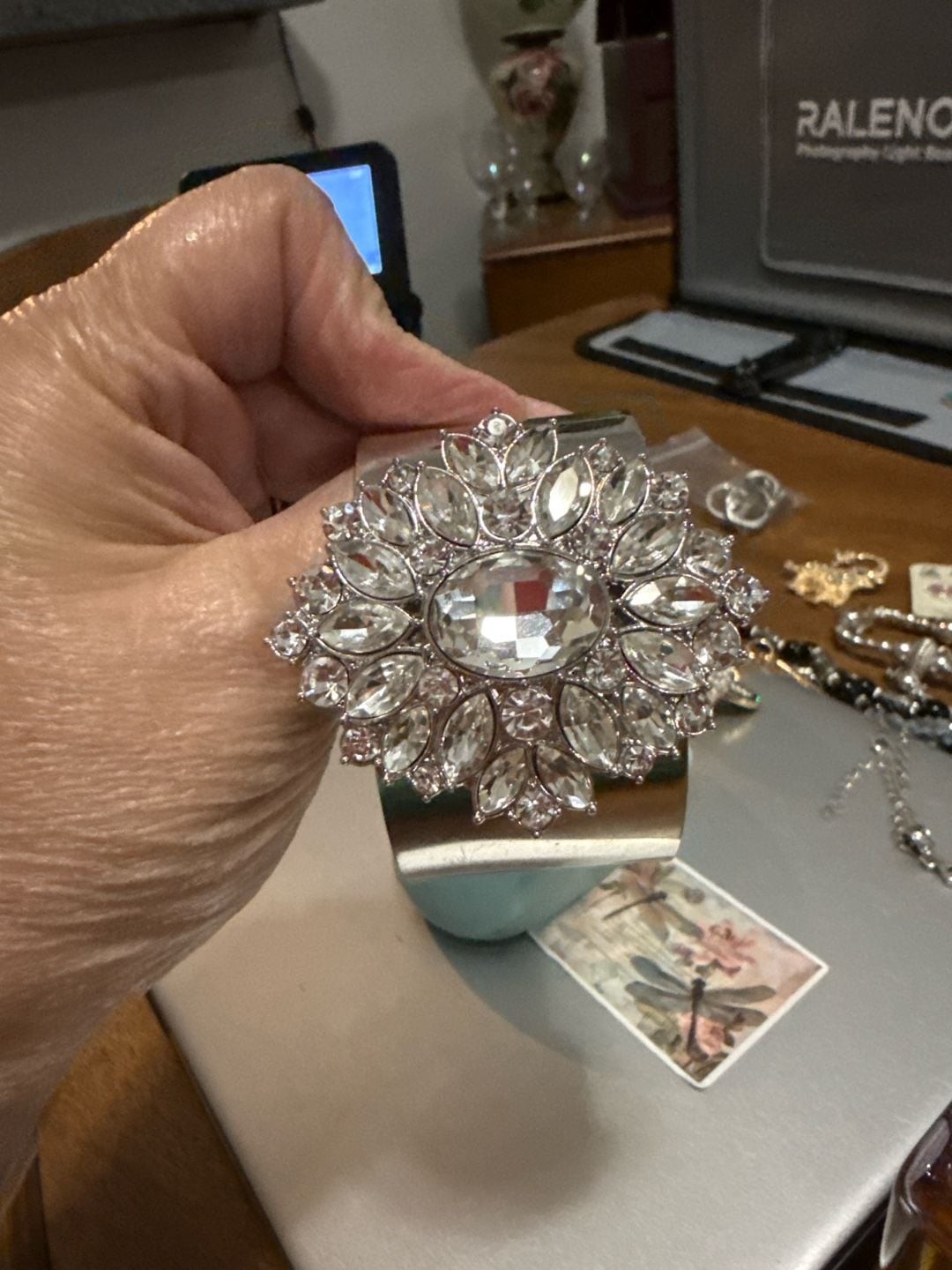 Silver Tone Wide Cuff Bracelet with Large Floral Crystal Rhinestone Motif
