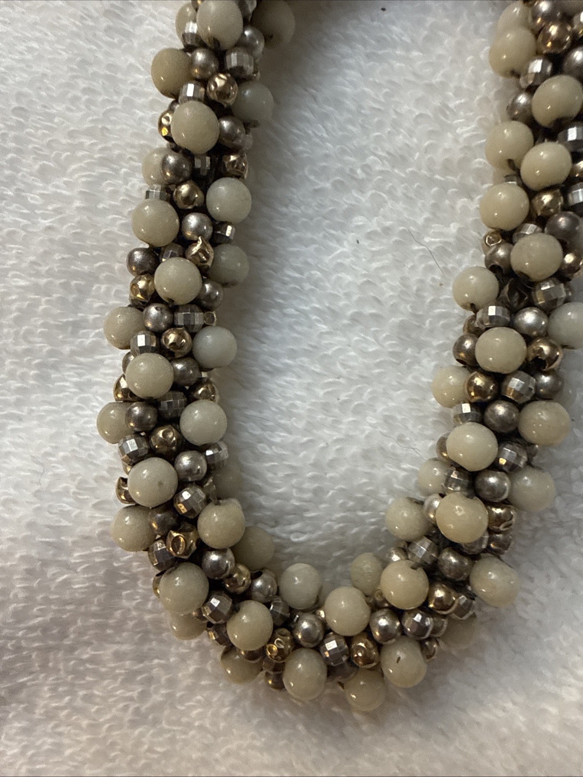 Ivory colored Ceramic Ball Bracelet With Tiny Gold and pewter beads