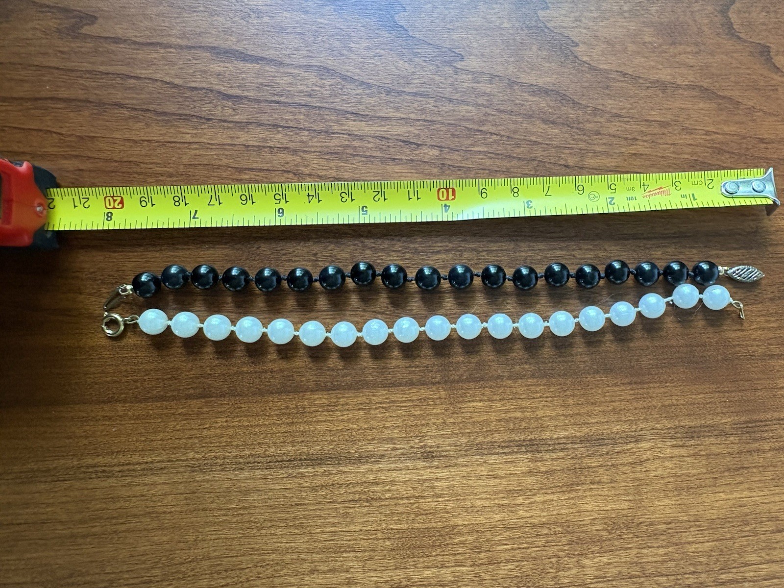 Lot of 2 bracelets- 1 Black & 1 White Beaded Bracelet Dangle Lobster Clasp 8 in