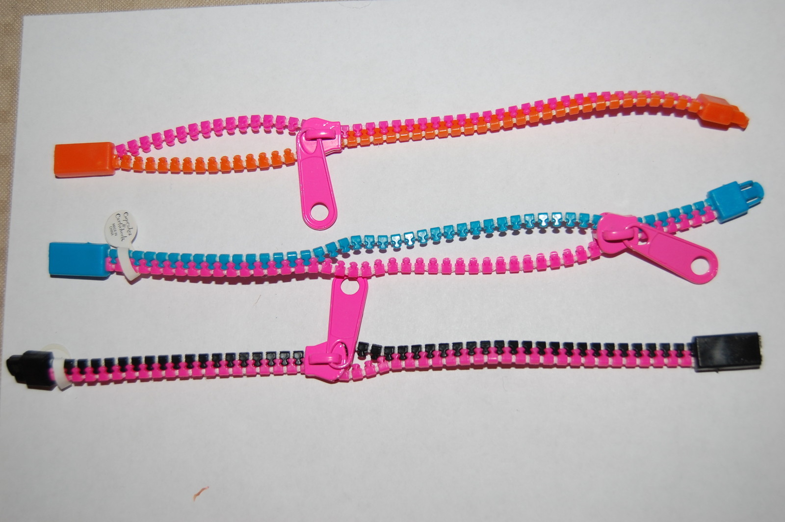 Lot of THREE Fashinn Bracelets ZIPPER Plastic PINK BLACK AQUA ORANGE 7 inch