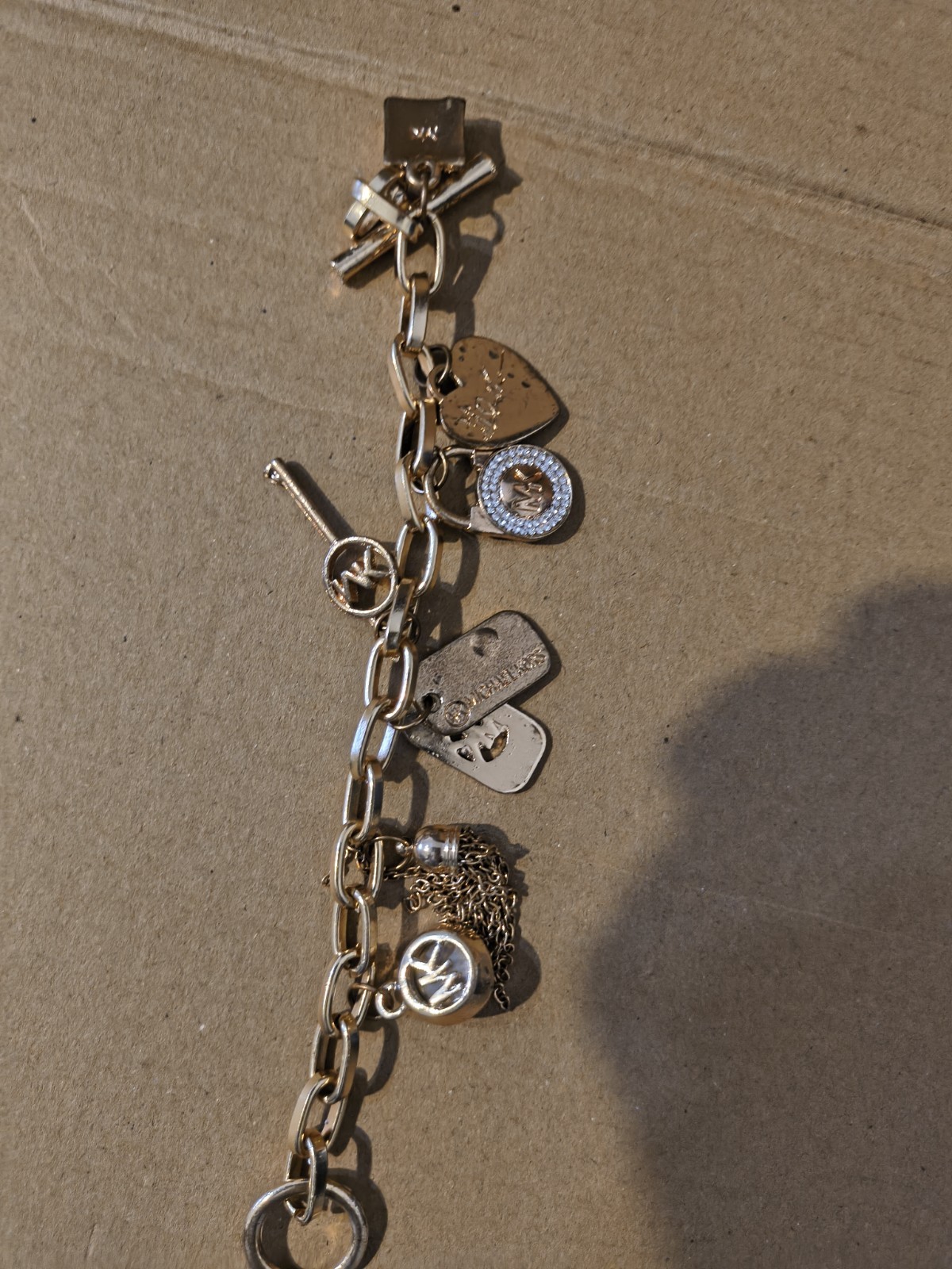 Michael Kors Gold Tone Toggle Oval Link Chain Bracelet Crystal Pavé Charm