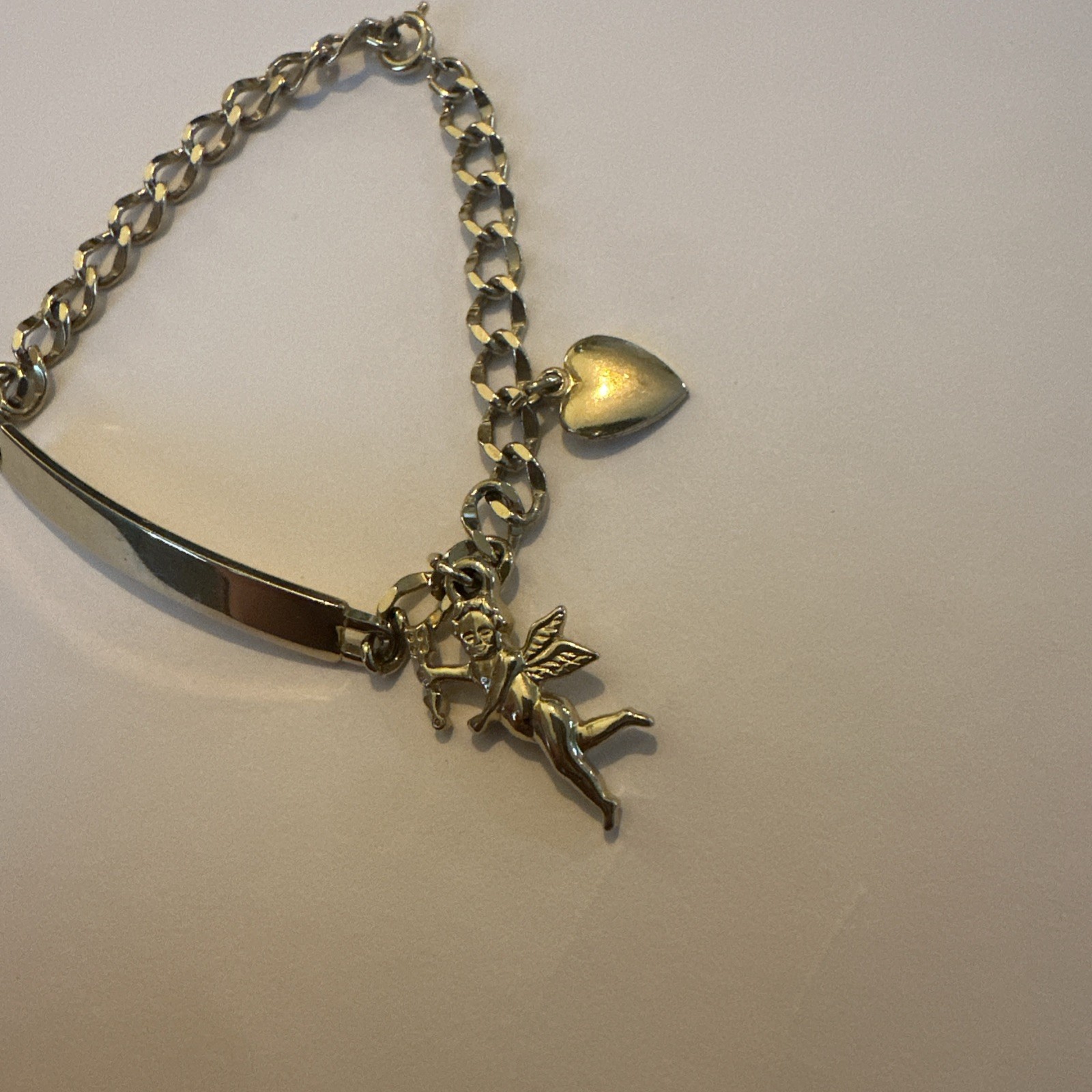 Vintage Speidel female yellow tone ID Bracelet W/ Angle And Heart Charms 7 Inche