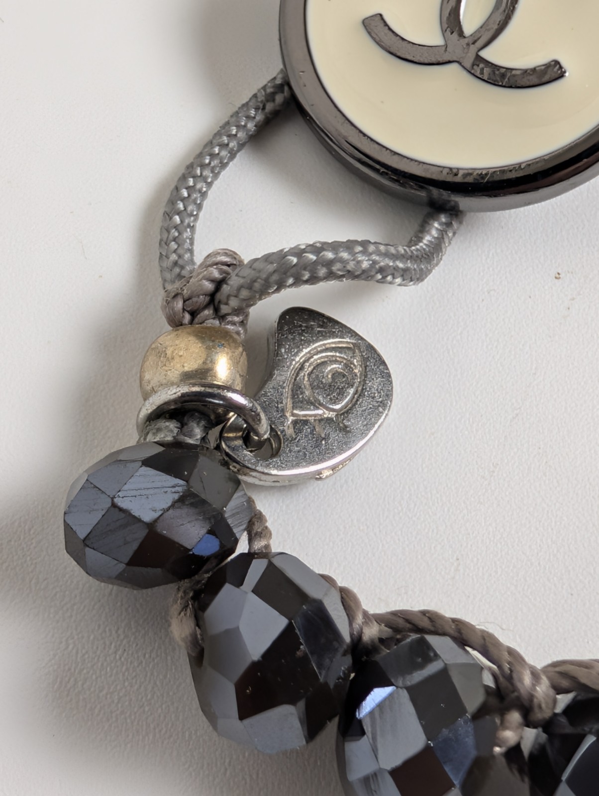 Chanel Button Logo Beaded Cord Bracelet Hematite Tone Gray IJewels Charm
