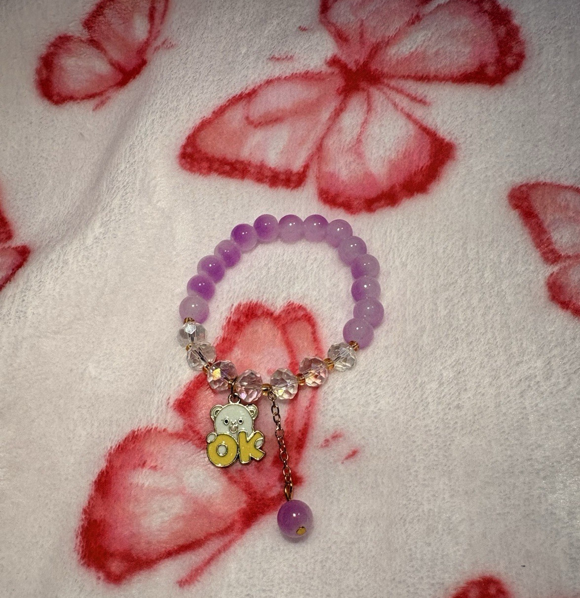 Purple Beaded Stretch Charm Bracelet Butterfly Theme w/ “OK” Dangle