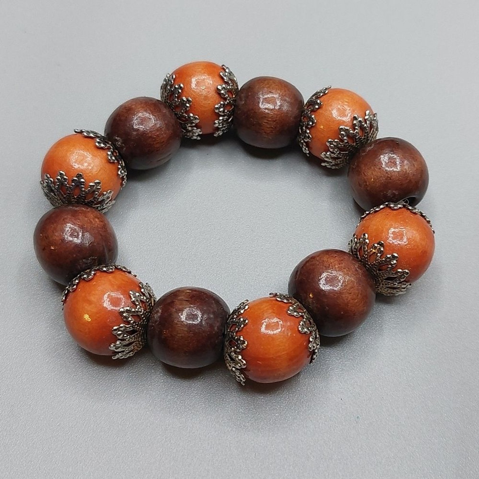 Brown Brownish Orange Beaded Bracelet Accented with Silver Filigree End Caps