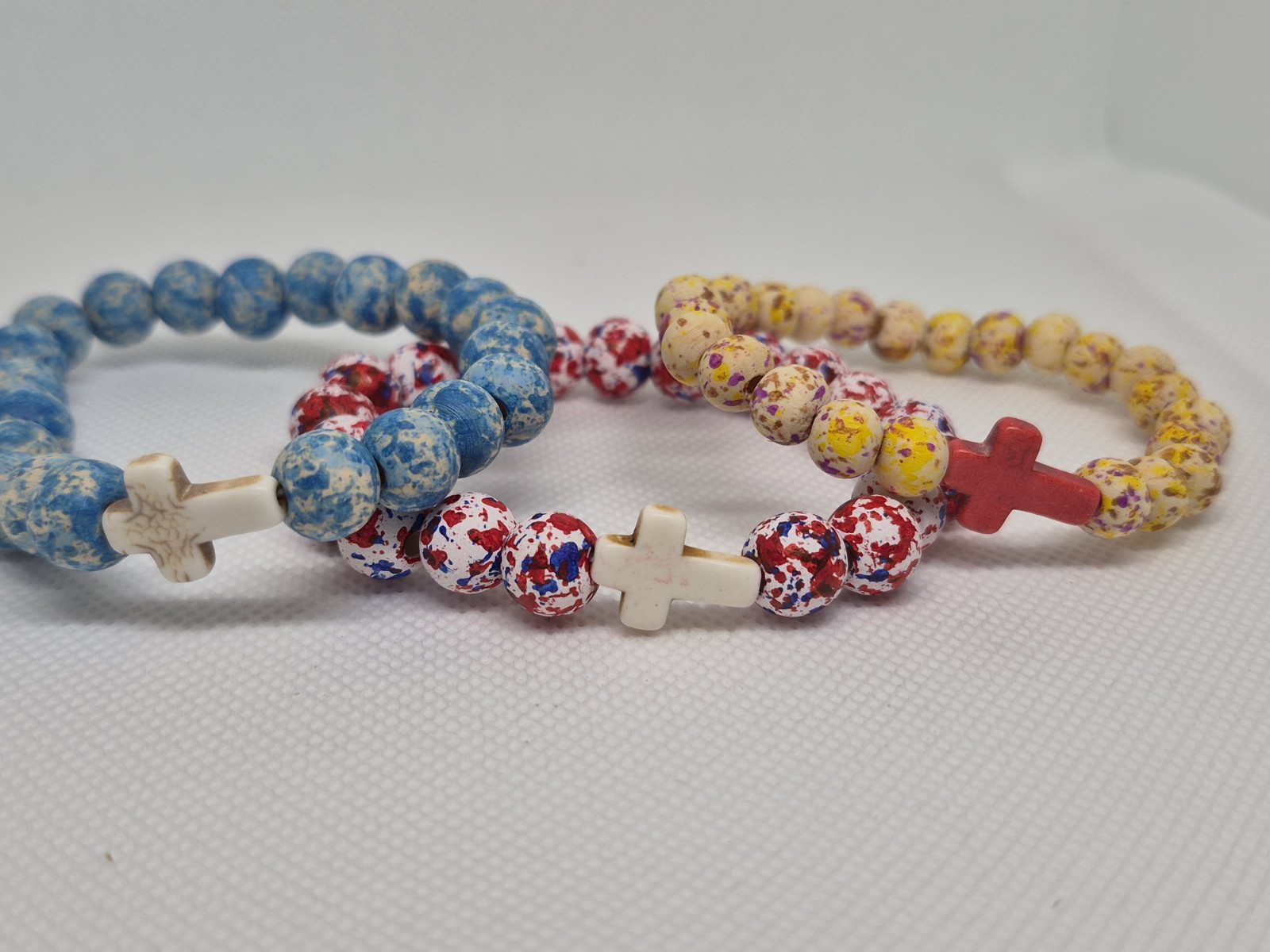 Set of 3 Multicolor wood Round Beaded Stretch Bracelets w/ Cross Dangle Charms