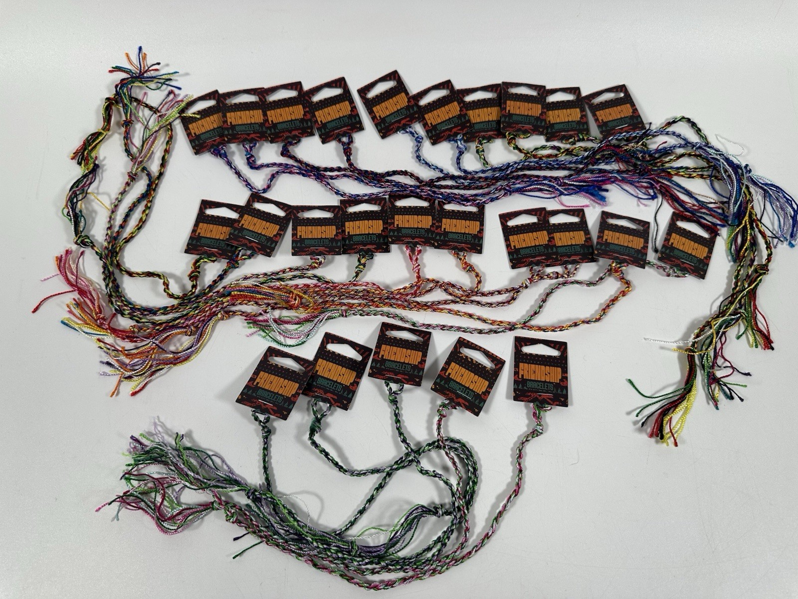 Lot of 25 Friendship Bracelets New Tags Thin Braided Cord Multicolor Tie On
