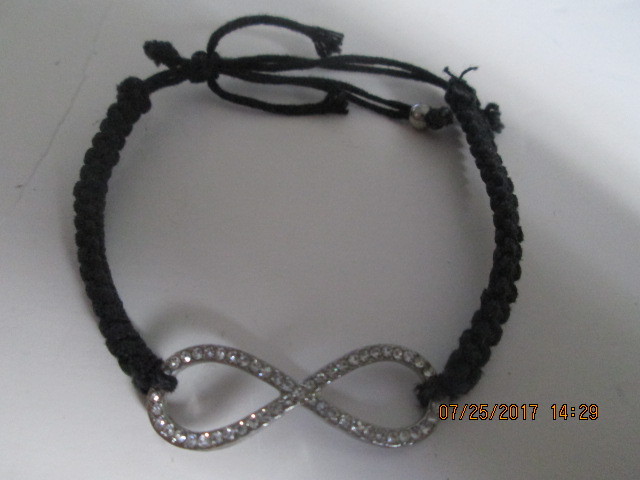 Black weaved bracelet with figure 8 clear stones