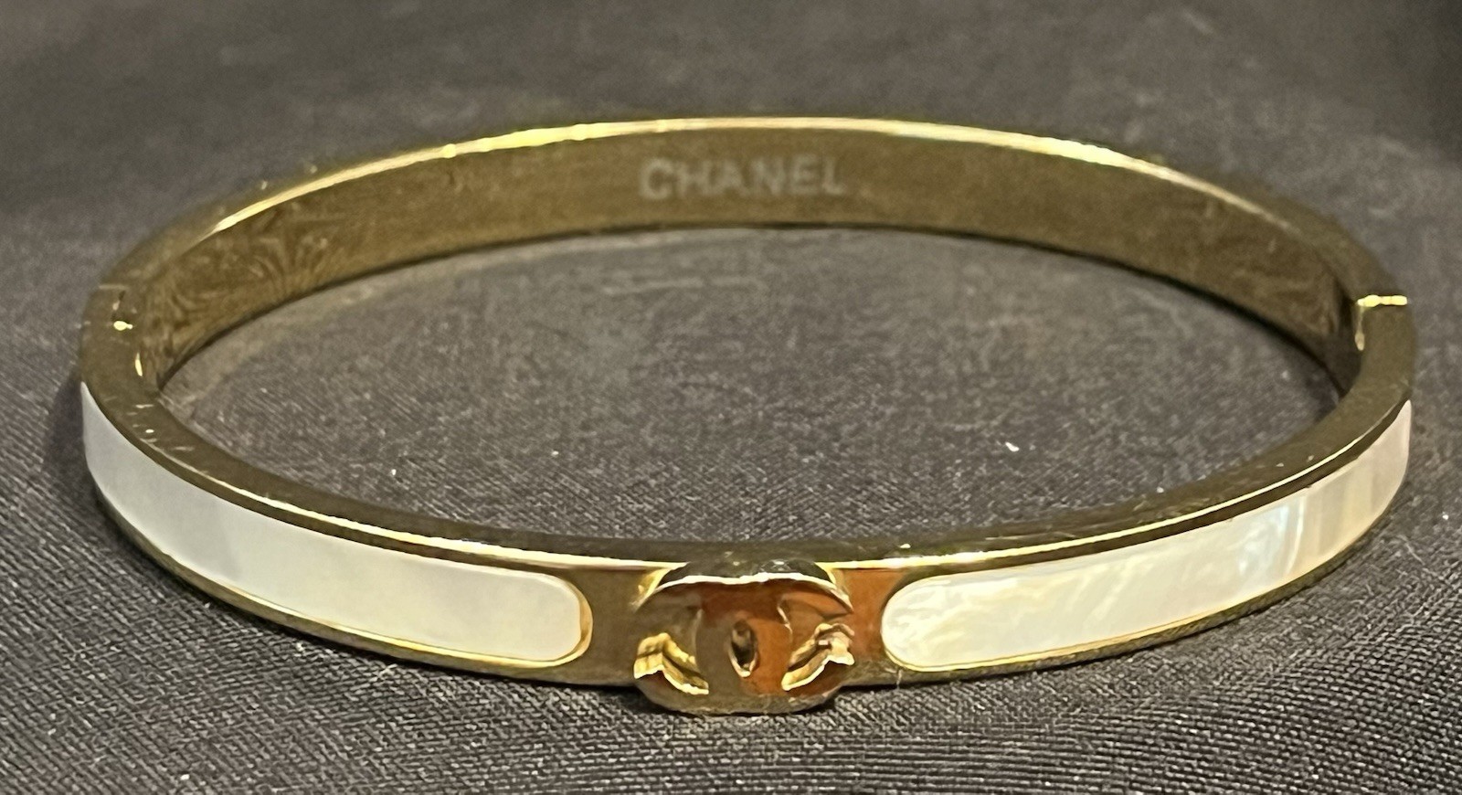 Authentic CHANEL CC Mother of Pearl Bangle Gold Tone White Enamel Hinged Cuff