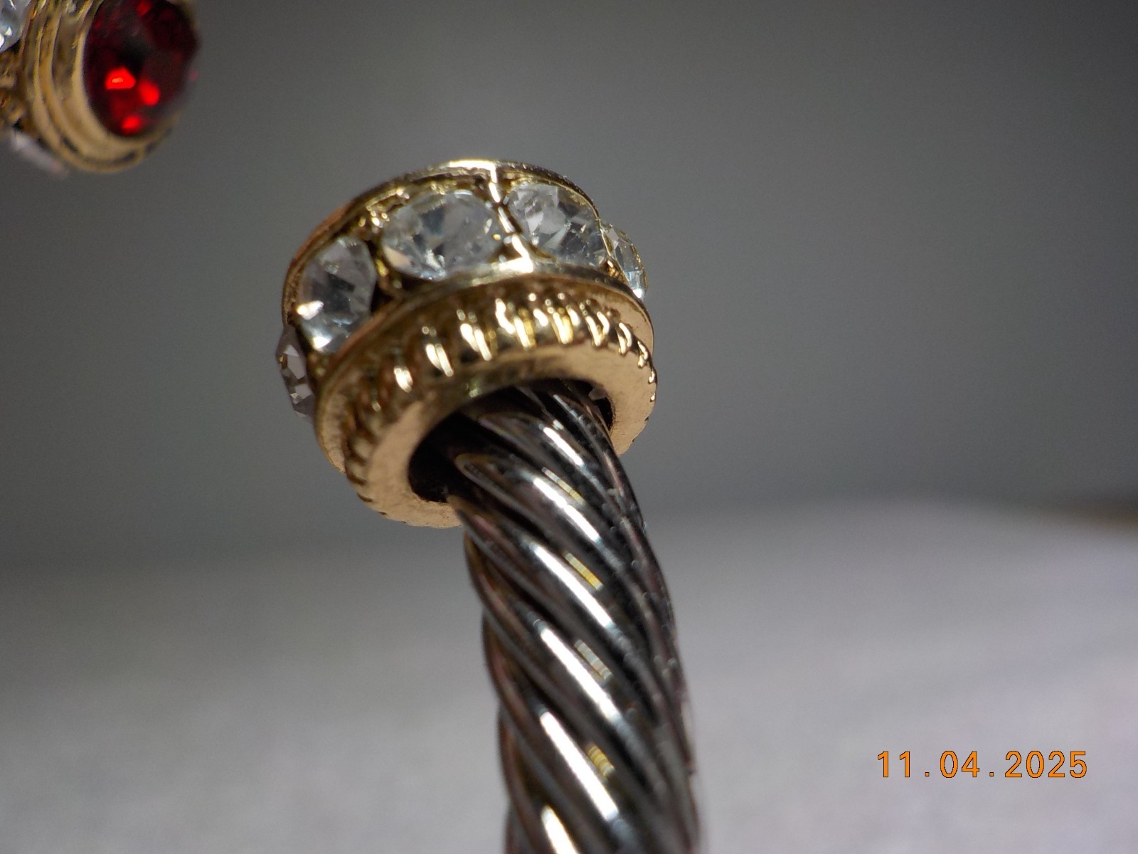 TWO-TONE GOLD/SILVER ROPE STYLE CUFF W/RED/CLEAR CRYSTAL ENDS