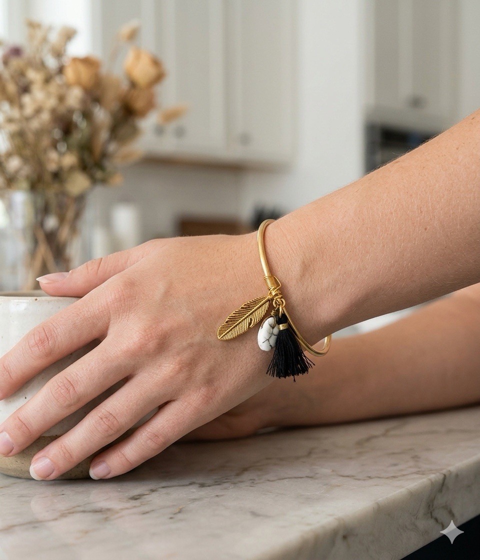 Gold Adjustable Cuff Bracelet with Feather, White Stone, and Tassel