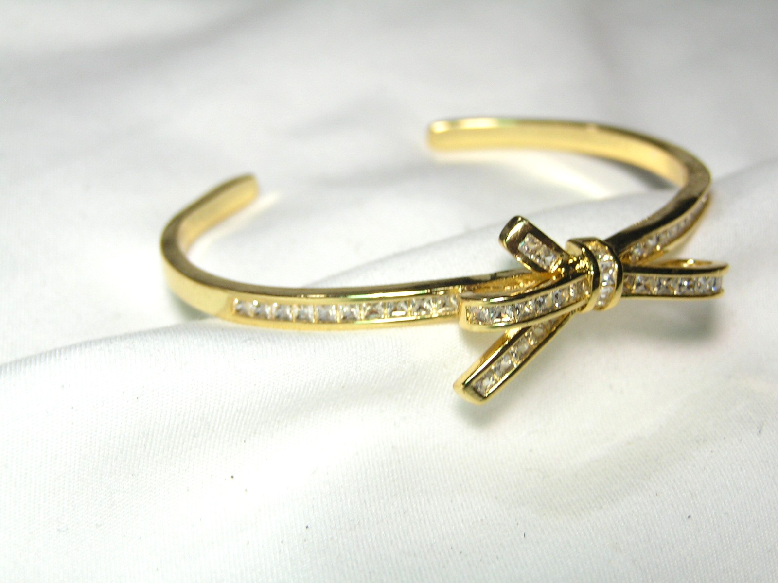 …Beautiful Gold Tone, Channel Set Square Crystals Bow Cuff Bracelet…