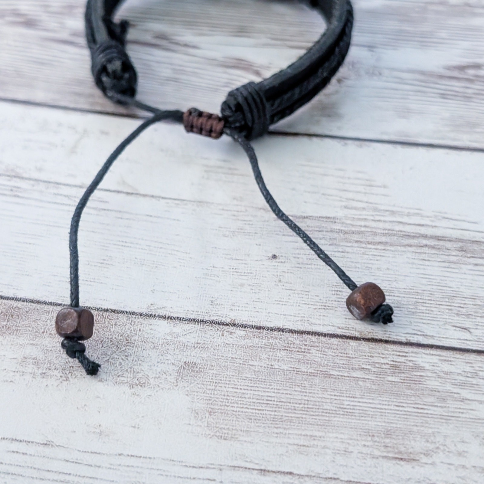 Tie Bracelet with Celtic Like Charm – Leather?